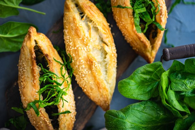 Georgian pie with spinach and sesame seeds on a plate