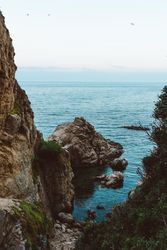 Gorge in rocks with ocean bay