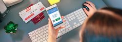 Woman in a travel agency booking a trip looking at the covid pas