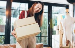 Dressmaker with boxes ready for shipment