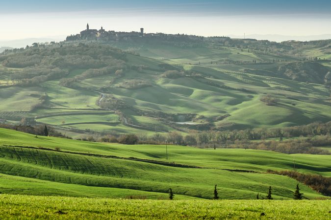 Majestic green valley with town on top