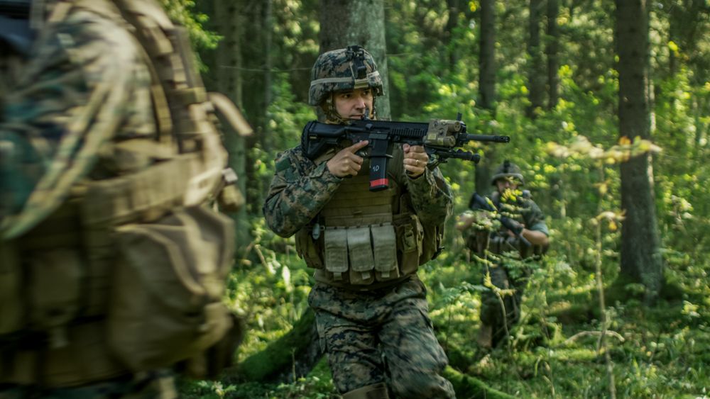 Squad of Five Fully Equipped Soldiers in Camouflage on a Reconnaissance Military Mission