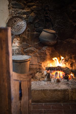 Kitchen with fireplace of ancient village cottage