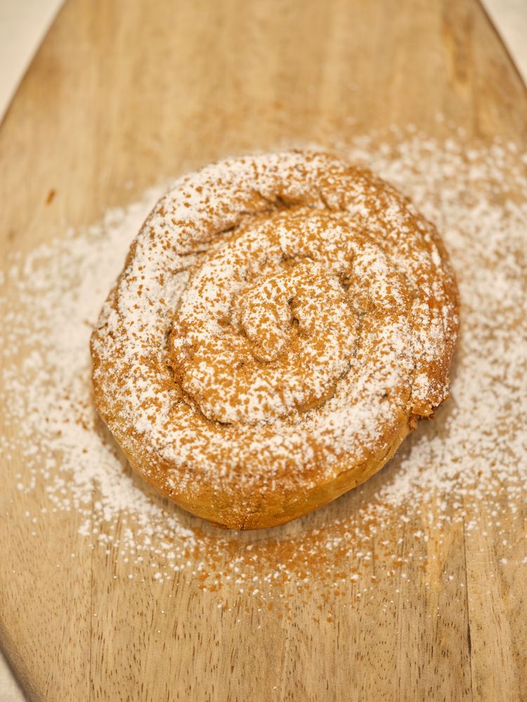 Pastry on cutting board in bakery