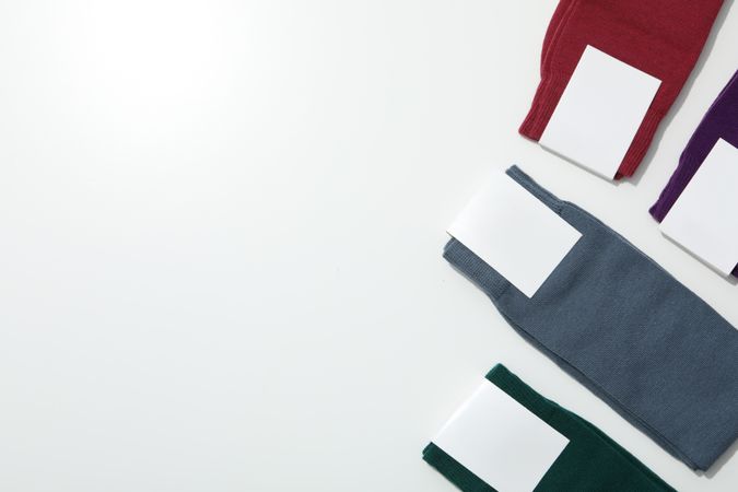 Multicolored high socks on a light background.