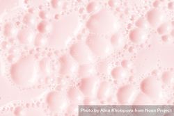 Light pink soap bubbles on liquid surface bDD7Kb
