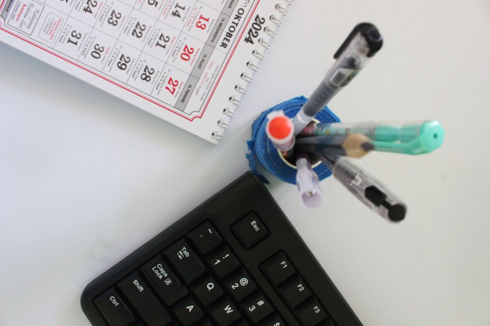 Layout Featuring Pencils Keyboard and Daily Planner