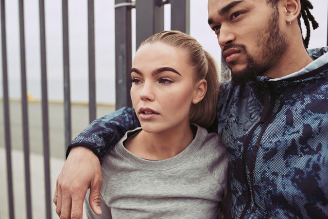 Attractive couple looking away with distracted facial expressions
