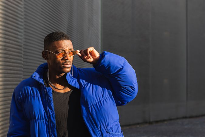 Stylish Black man in sunglasses on street