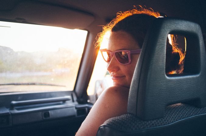 Young woman traveling in car