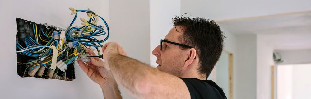 Electrician working on the electrical installation of a house
