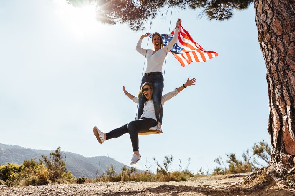 Two women with an flag