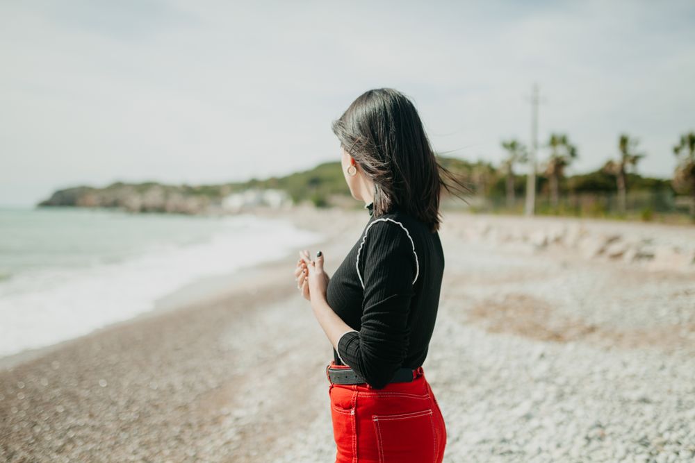 Anonymous female looking at sea