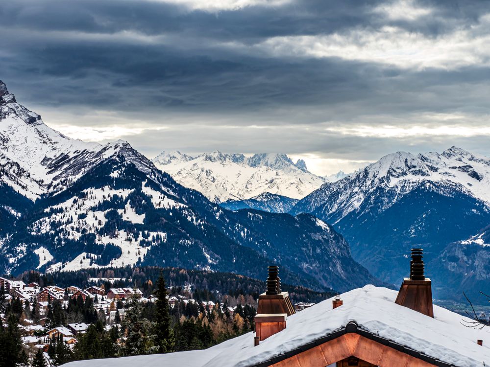 Swiss Alps winter landscape with snow and sun, mountains in Europe