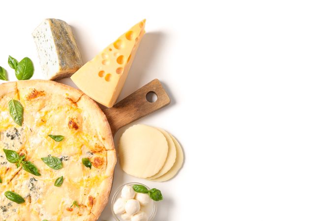 Tasty cheese pizza on wood board and ingredients isolated on plain background
