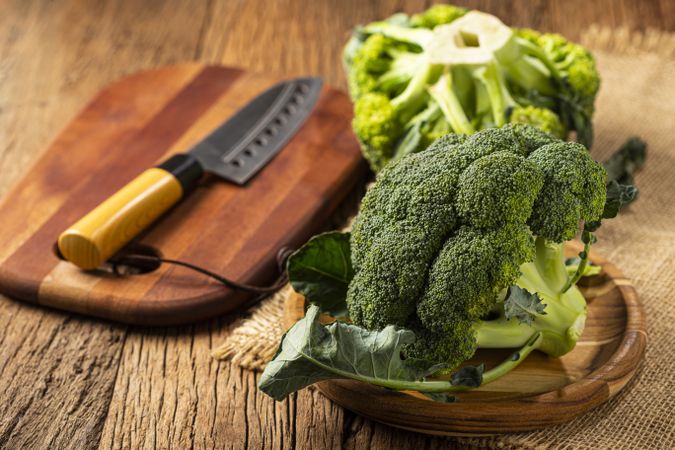Green organic broccoli on the table.