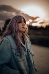 Smoking trendy woman in autumn nature
