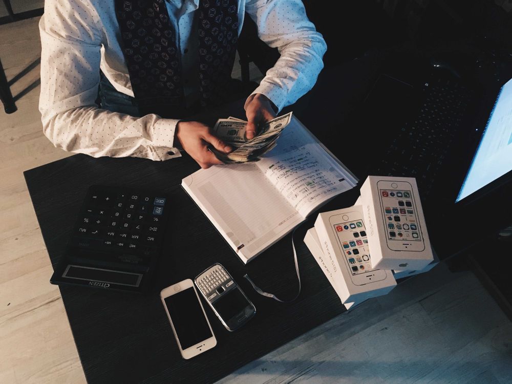 Man counting money in an office