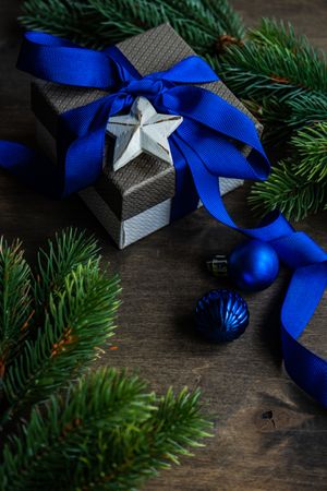 Christmas gift concept with blue ribbon and star decoration