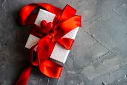 Valentine concept with gift with red ribbon and heart