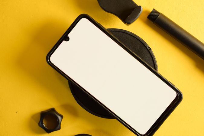 Mock up phone on accessories on yellow background