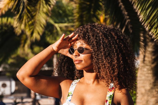 Trendy female on tropical street