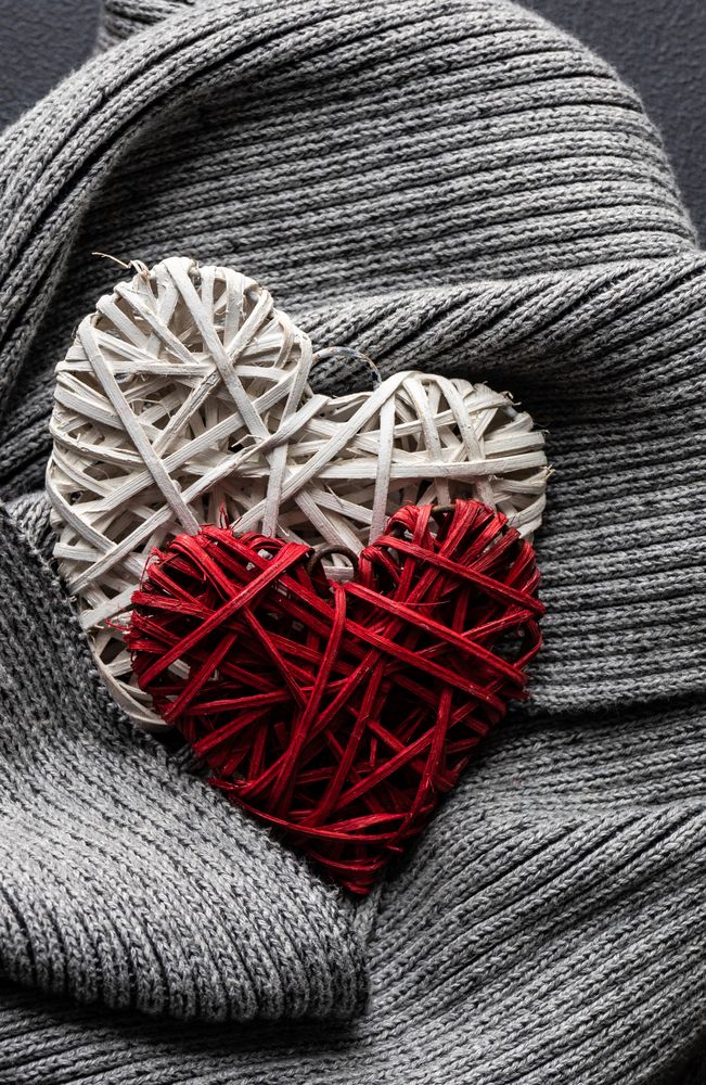 Thatched heart decorations on grey knit