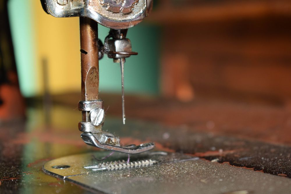 Side view of metallic sewing machine