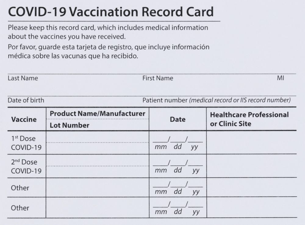 Covid 19 vaccination record card in full frame layout