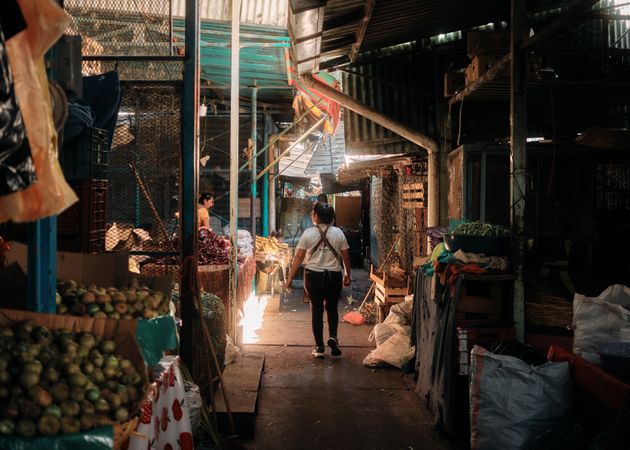 Back of woman walking through market