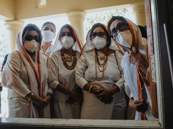 Group of Torajan women mourning at funeral during coronavirus