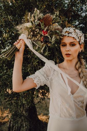 Woman in dress with flower bouquet