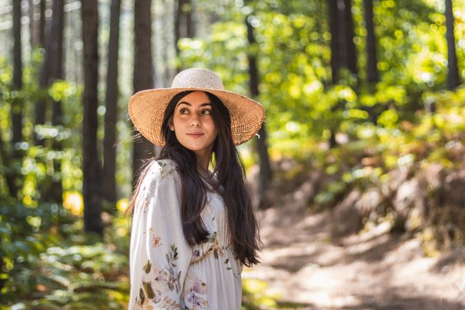 young woman walking in the forest