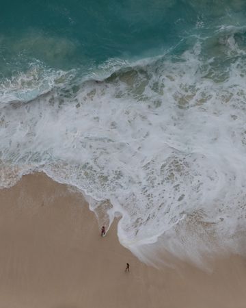 Aerial shot of couple on beach
