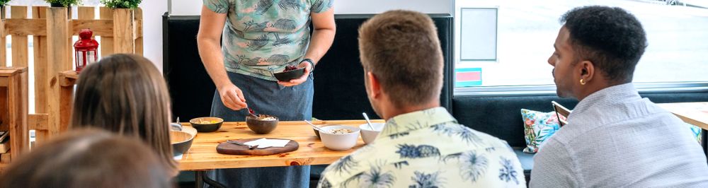 Young cook giving a cooking workshop