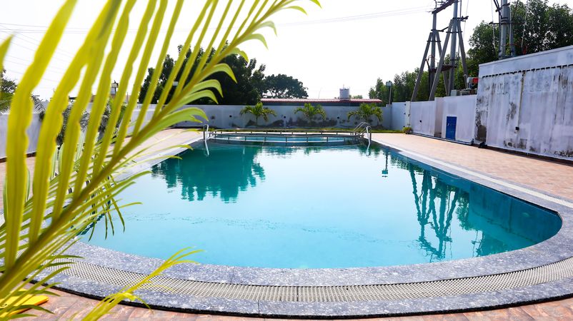 Clean outdoor swimming pool with clear blue water at a resort