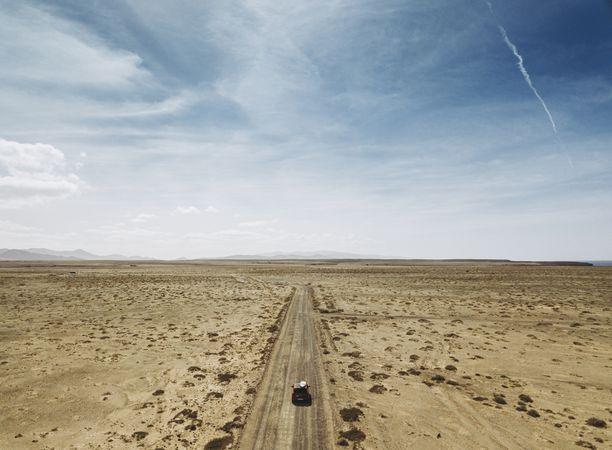 Car driving on road in picturesque desert