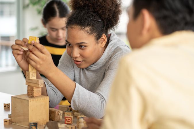 Two female students building blocks in class