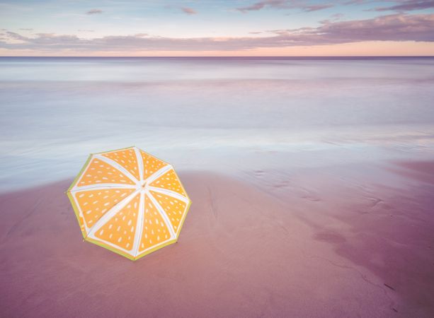 Umbrella on beach near sea