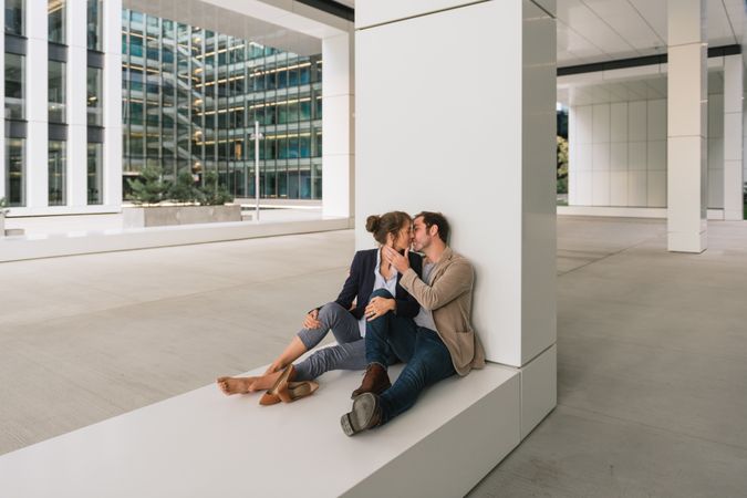 Businesspeople resting outside modern building