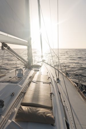 Seats on nose of yacht on water