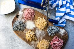 Top view of Italian homemade pasta on cutting board