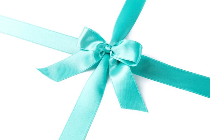 Turquoise ribbon with bow isolated on plain background. Gift concept