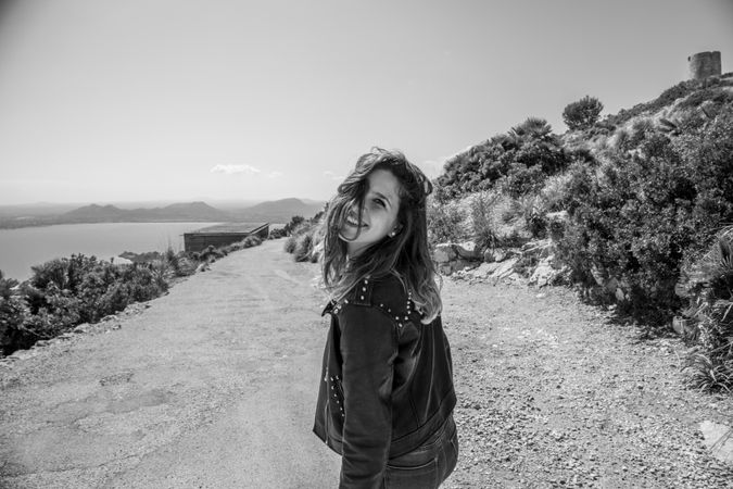 Smiling female on seashore