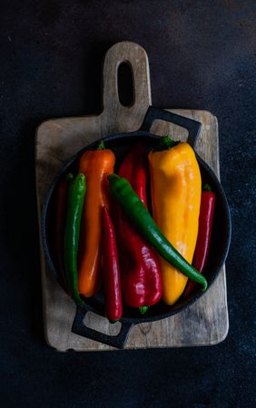 Fresh raw bell peppers in a pan