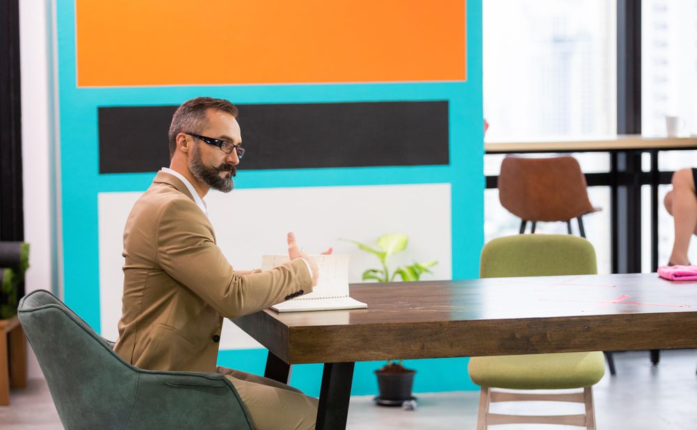 Man at work in bright colorful office