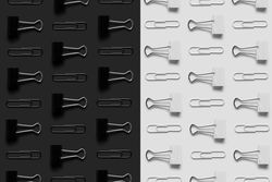 Paper clips and bider clips on monochrome background