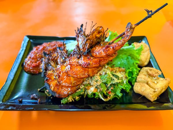 Grilled Prawns Served with Vegetables, Chili Sauce, and Fried Tofu