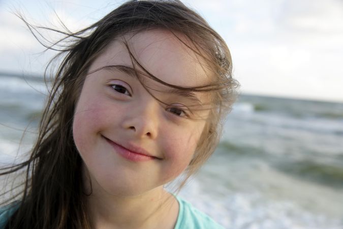 Close up of young girl at the beach