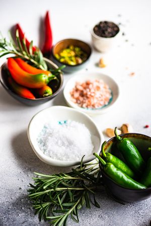 Counter with peppers, herbs and salt